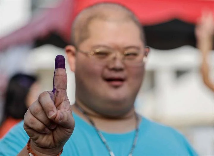 唐氏症青年興奮投下手中一票　期待明天會更好