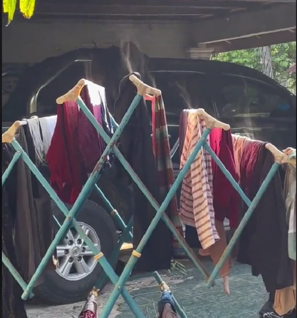 婦女烈陽下曬衣服　驚見衣服冒煙